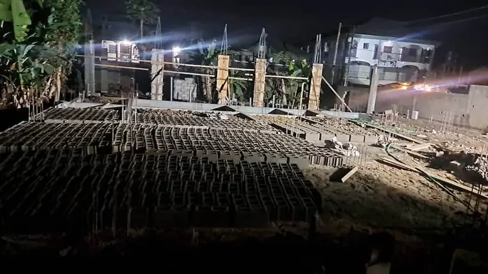 Clifton Group building construction, night works with stacked blocks